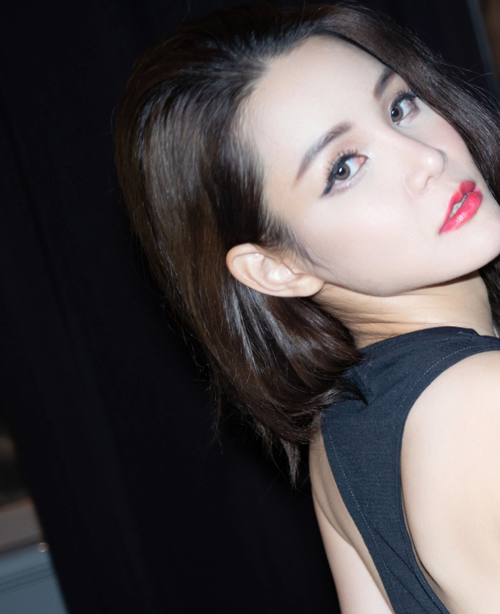 Her subtle smile holds the secret power of Tao Xinning