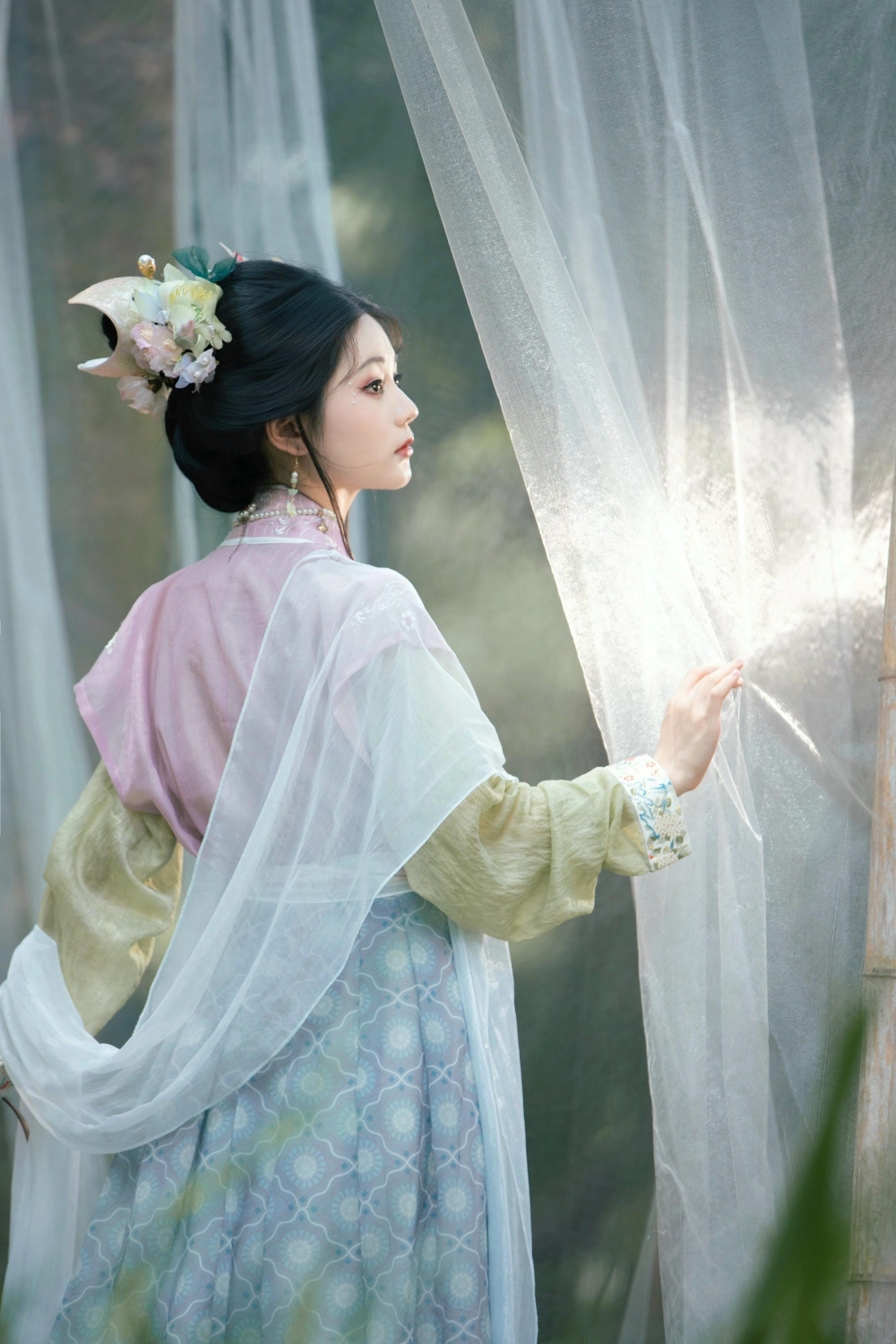 A serene outdoor portrait of Wu Ying Kunkun