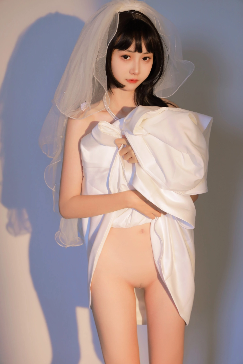 A stunning portrait of Yui Goldfish in white