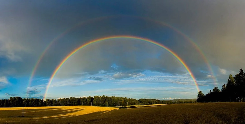 A stunning double rainbow visible after a rain shower