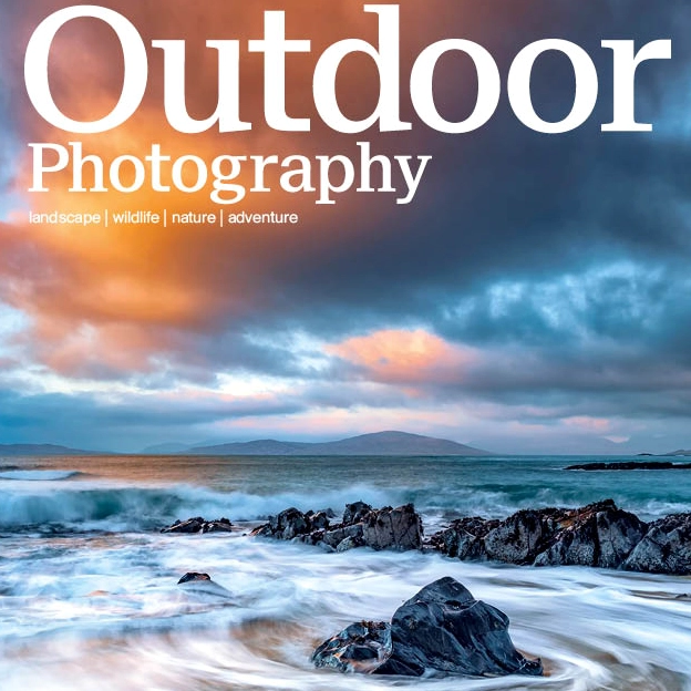 A stunning fogbow arching across a misty landscape