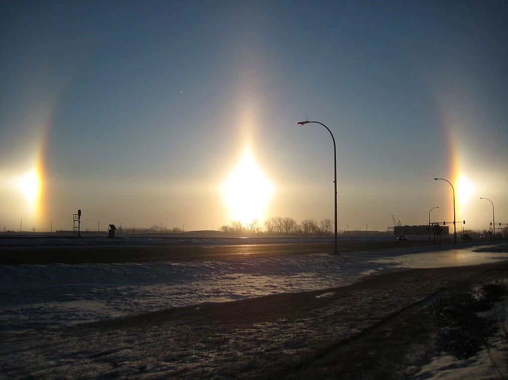 A vibrant sun dog (parhelion) phenomenon observed next to the Sun