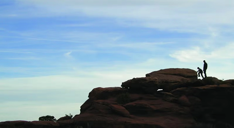 A wide view of cirrostratus clouds covering the sky, showcasing their thin, sheet-like nature.