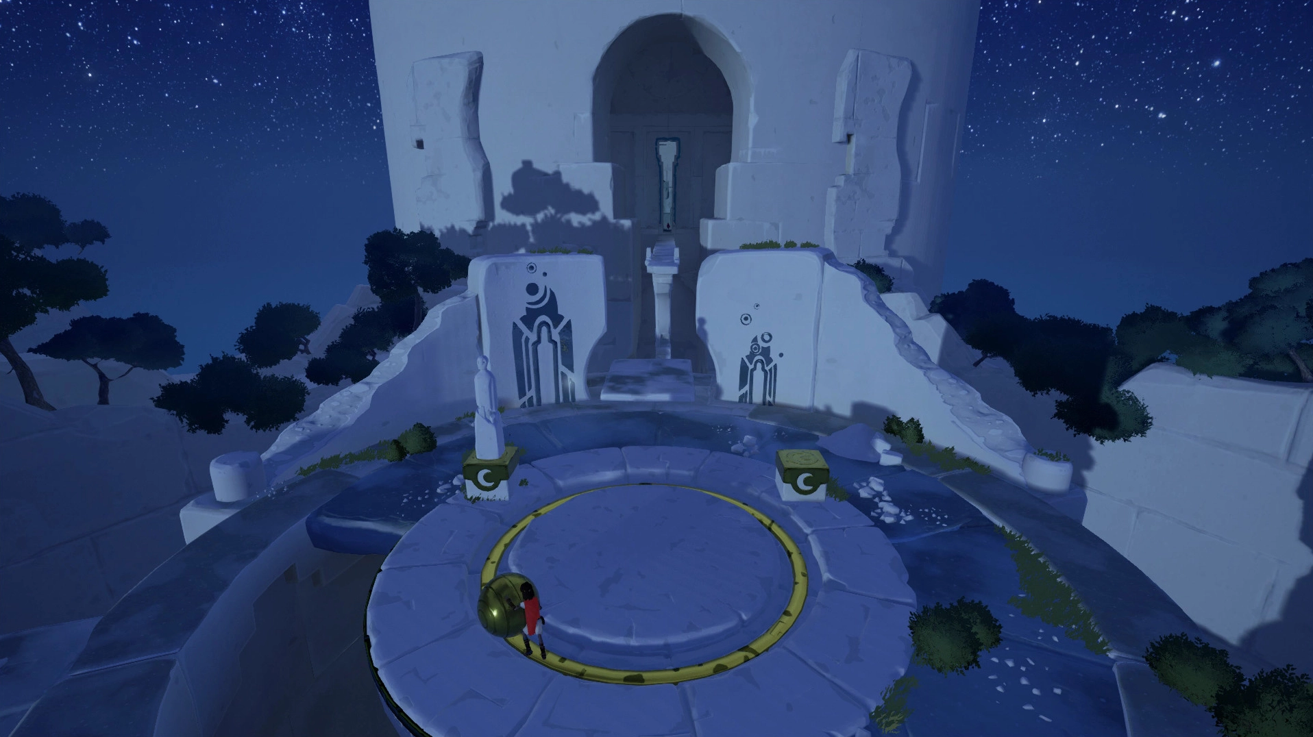 A young boy stands on a cliff overlooking a vast, sunlit island in RiME.