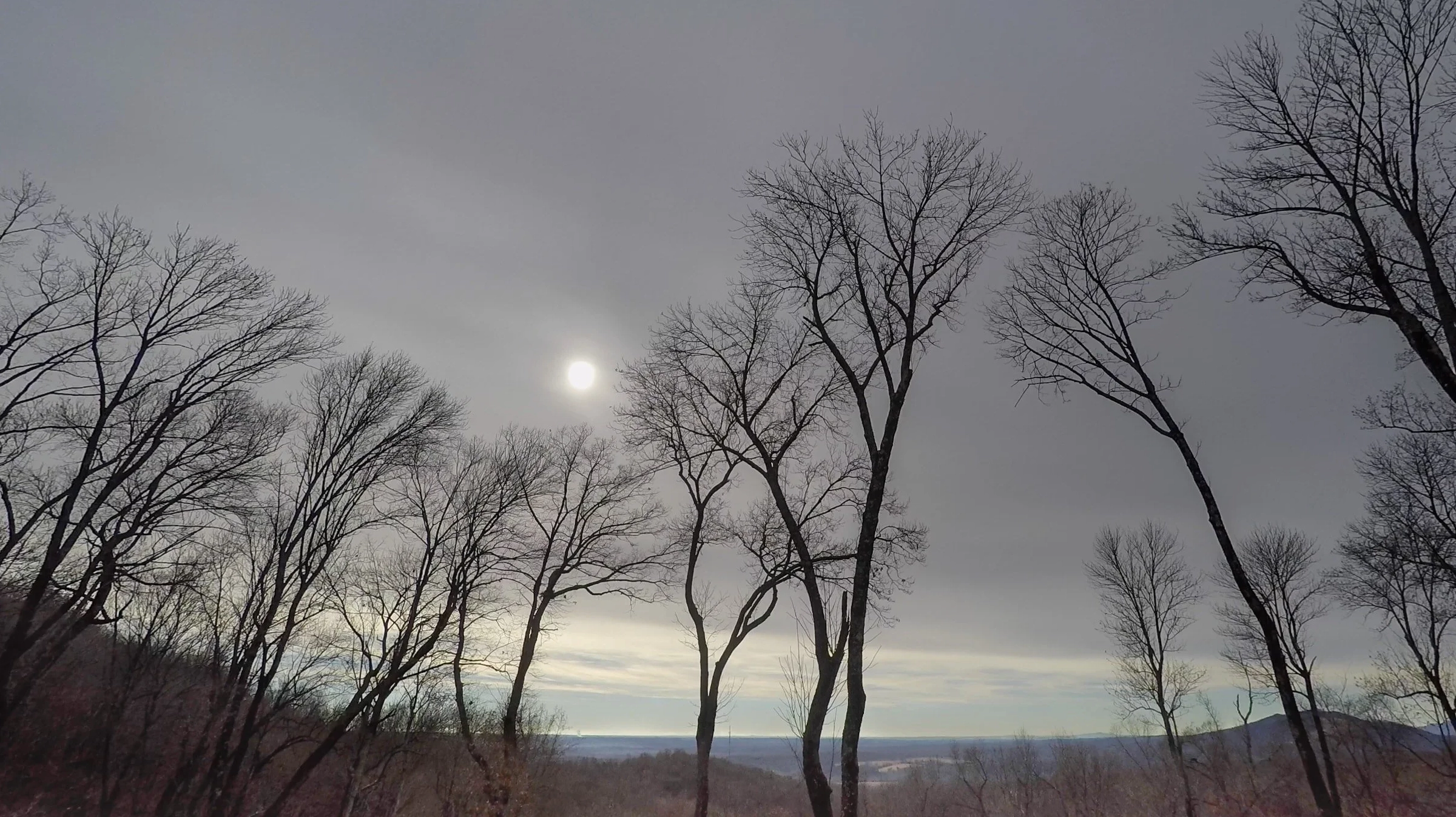 Altostratus translucidus clouds with a visible sun