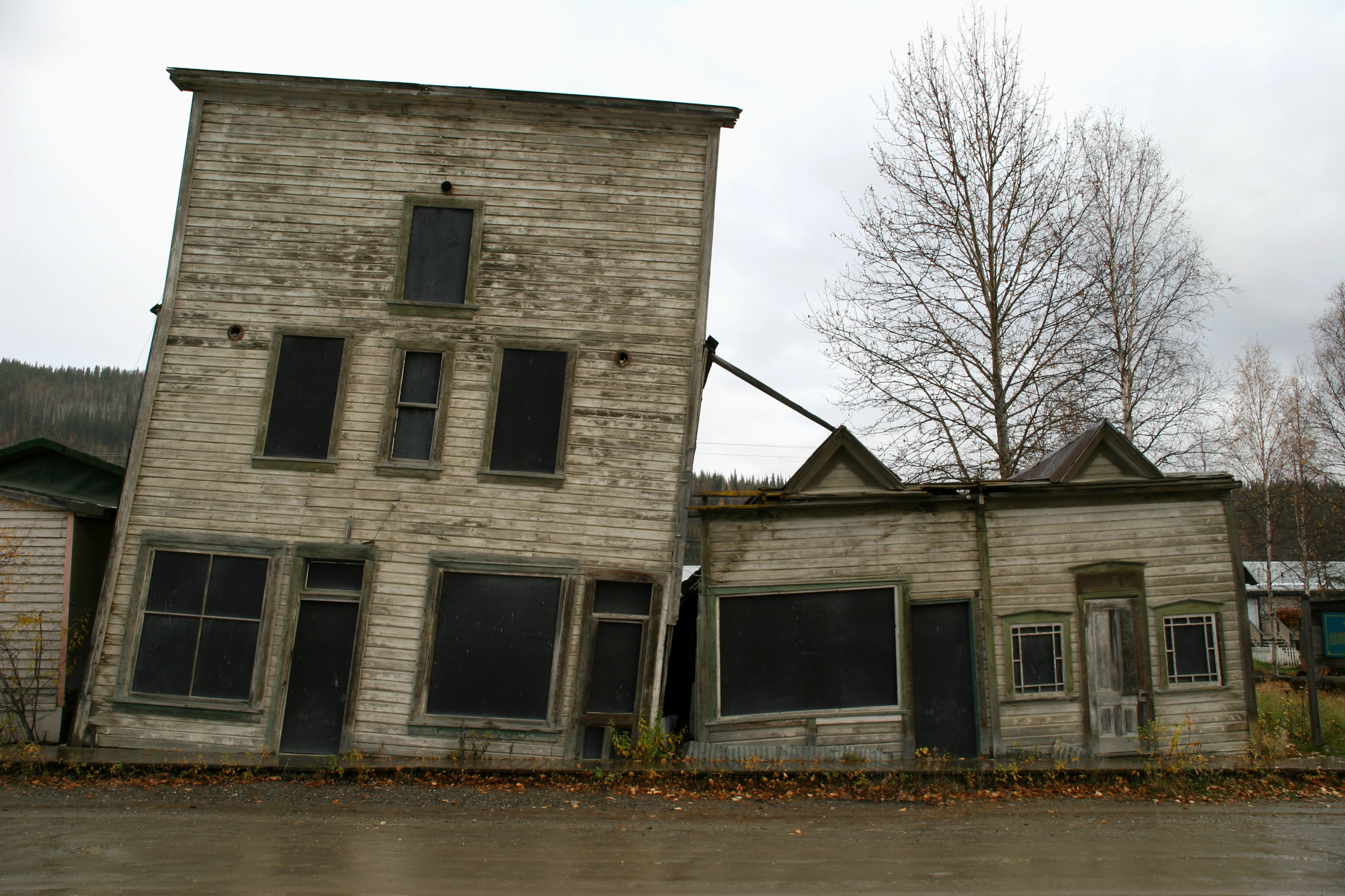 Damaged buildings in Dawson City, Canada, due to permafrost thaw.