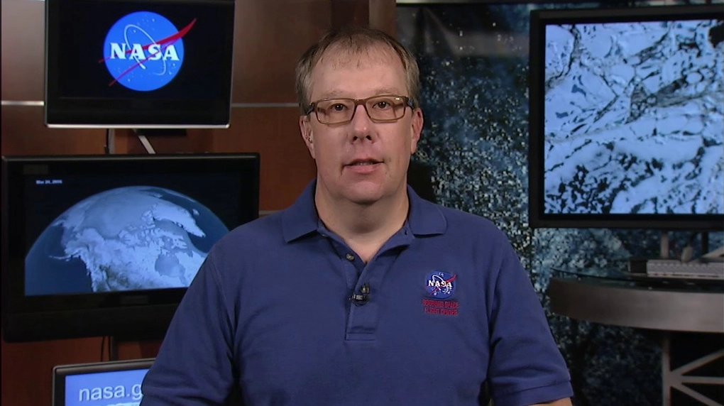 NASA scientist Dr. Walt Meier studying atmospheric data
