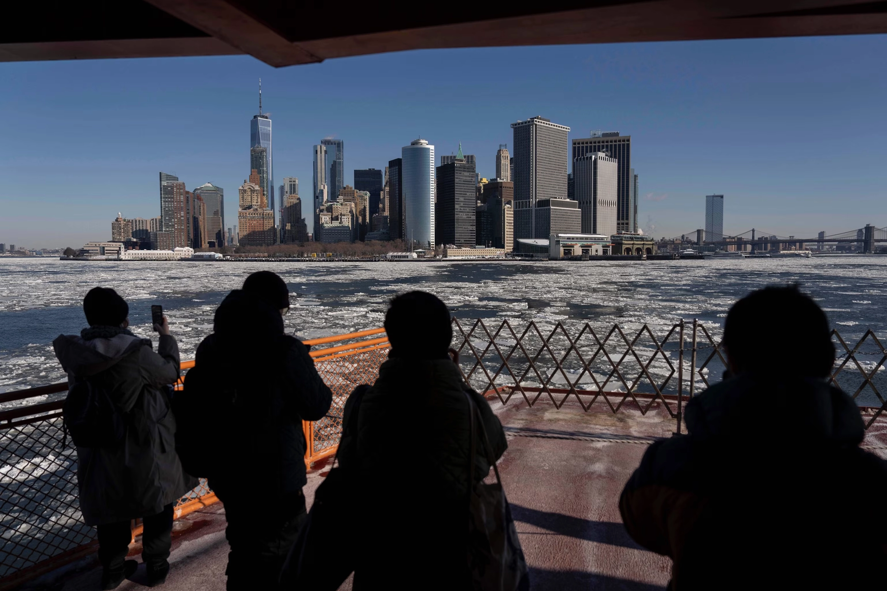 People take the Staten Island Ferry amidst icy conditions on the Hudson River