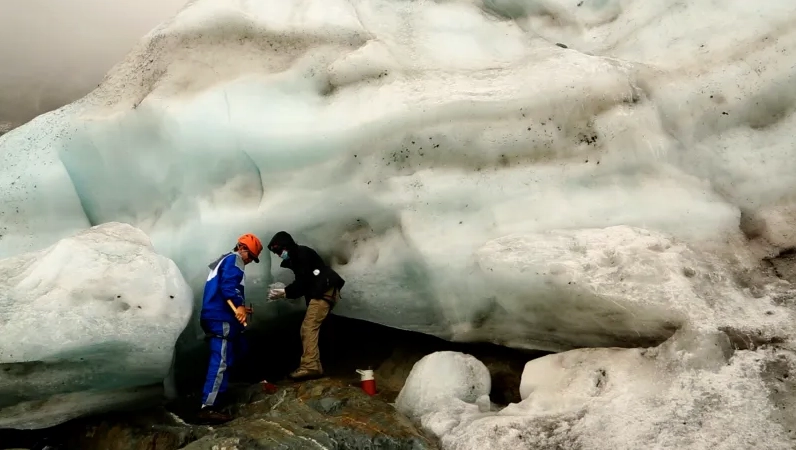 Scientists collecting ice samples from Humboldt Peak Glacier.