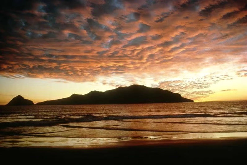 Stratocumulus clouds forming at sunset, showing their lumpy and layered appearance.